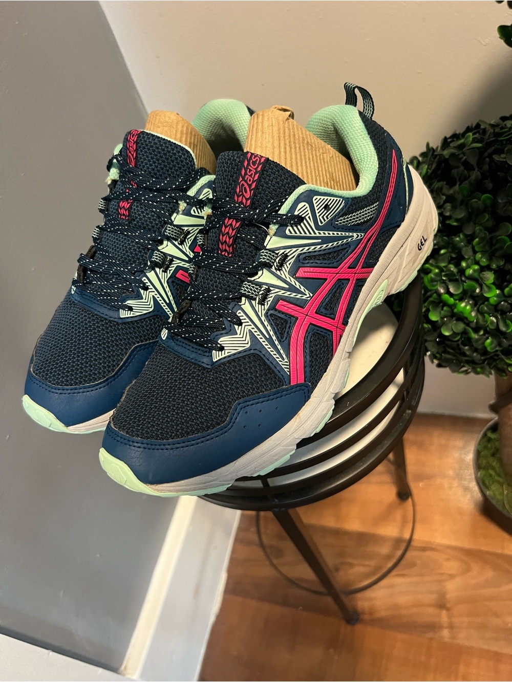 These shoes are ASICS Gel-Venture 8 for women in navy blue and pink.size 9.5